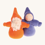 An Orange Bearded Grimm's Dwarf, and a rainbow Indigo Grimm's Dwarf next to each other on a cream background