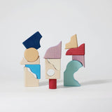 3 simple stacks using different handcrafted wooden Grimms pieces from the wave set.