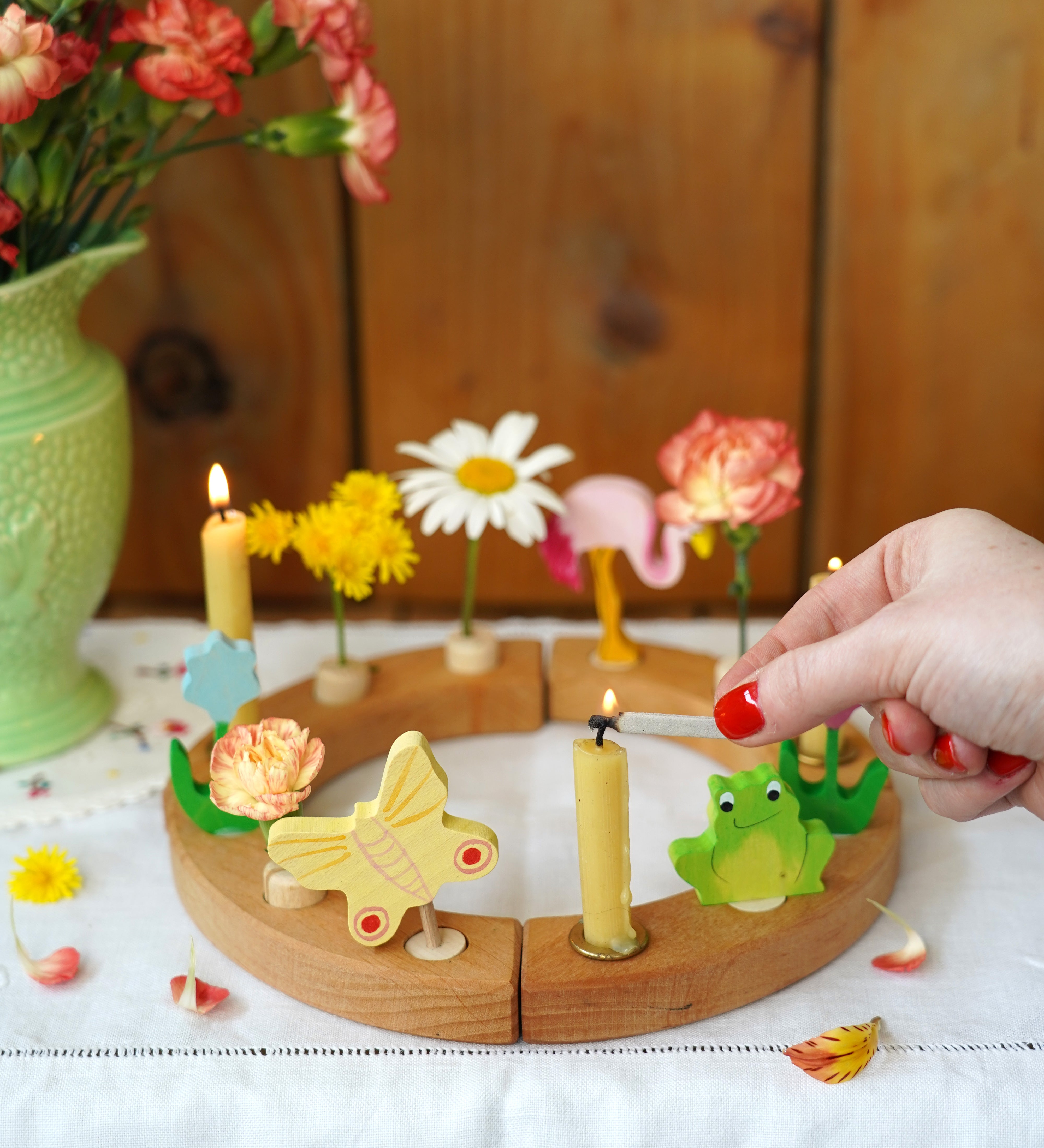 A beautiful sprint time display using a Grimm's Waldorf Celebration Ring, Grimm's decorative figures and Grimm's Candles
