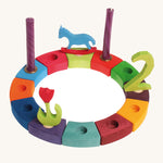 Grimm's 12-Piece Rainbow Birthday Celebration Ring on a white background with decorative figures and candles to celebrate a second birthday