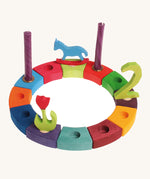 Grimm's 12-Piece Rainbow Birthday Celebration Ring on a white background with decorative figures and candles to celebrate a second birthday