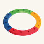 Grimm's 16-Hole Coloured Wooden Celebration Ring on a cream background