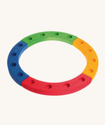 Grimm's 16-Hole Coloured Wooden Celebration Ring on a cream background