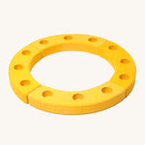 Grimm's Yellow 12-Hole Celebration Ring on a cream background. The celebration ring is made up from 4 wooden sections and has 3 small holes in each section