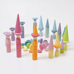 The Grimm's 12 Pastel Friends used in a play scene with other wooden Grimm's Pastel pieces