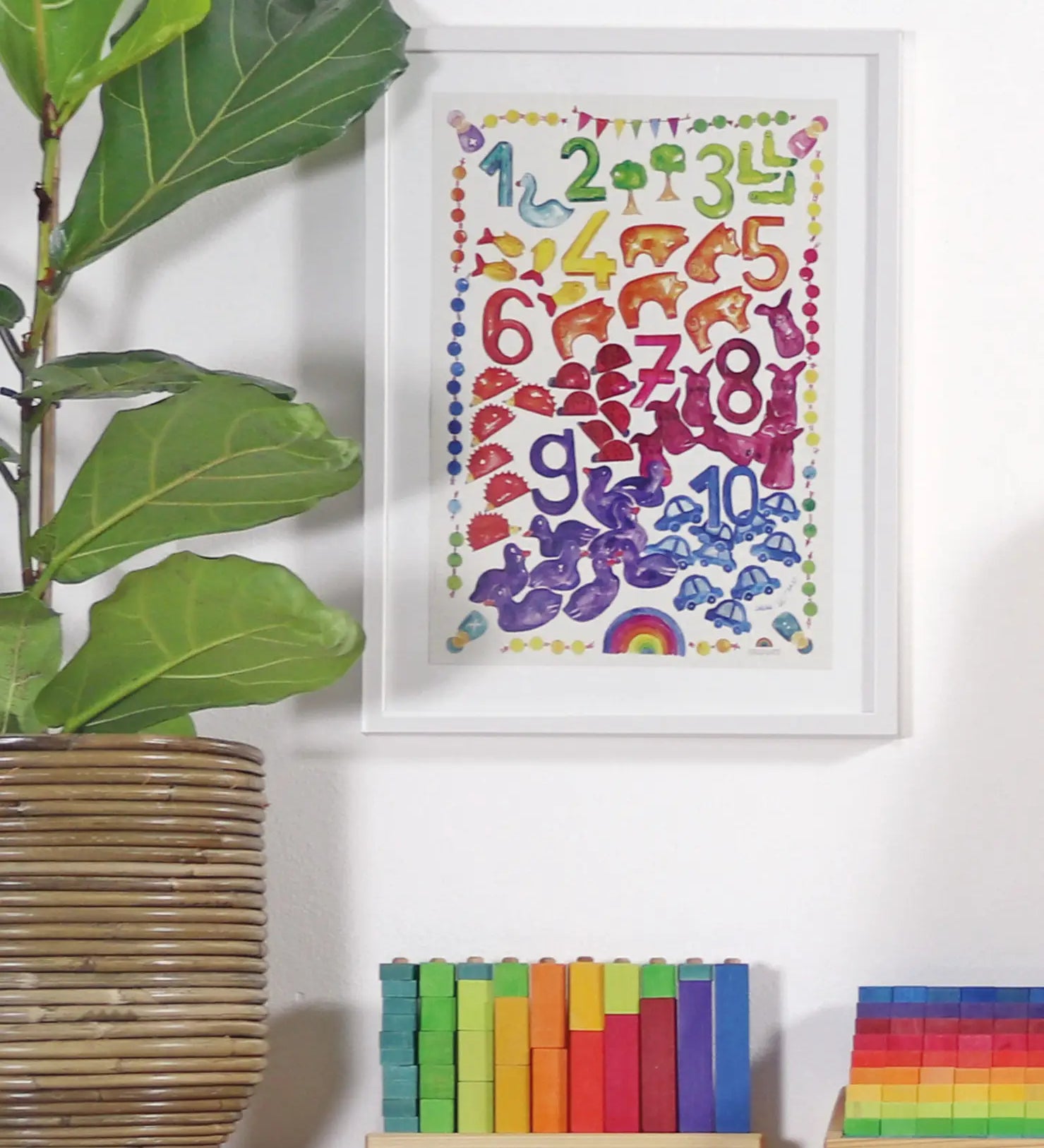 Grimm’s World of Numbers Art Print displayed above a matching counting stack game and counting pyramid