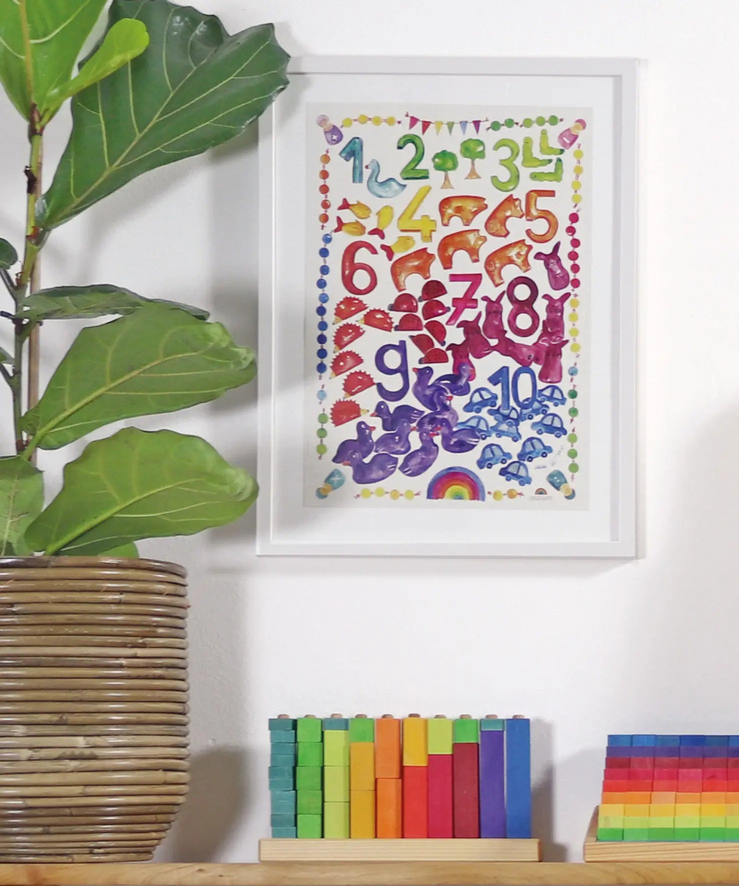 Grimm’s World of Numbers Art Print displayed above a matching counting stack game and counting pyramid