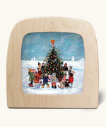 Toverlux silhouette of snowy Christmas scene, kids decorating a Christmas tree, for December celebrations.