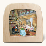 Toverlux silhouette of a cosy autumn winter scene, family reading a bedtime story in a cabin with a fireplace, for October, November and December celebrations.
