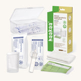 Haakaa colostrum collector feeding pack with pieces shown in sterile packaging.