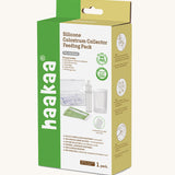 Haakaa colostrum collector feeding pack shown in the cardboard packaging box.