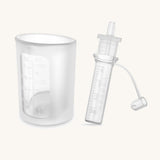 Haakaa colostrum collector and storage tube showing measures on the side.