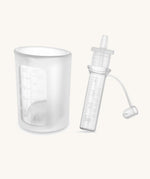 Haakaa colostrum collector and storage tube showing measures on the side.