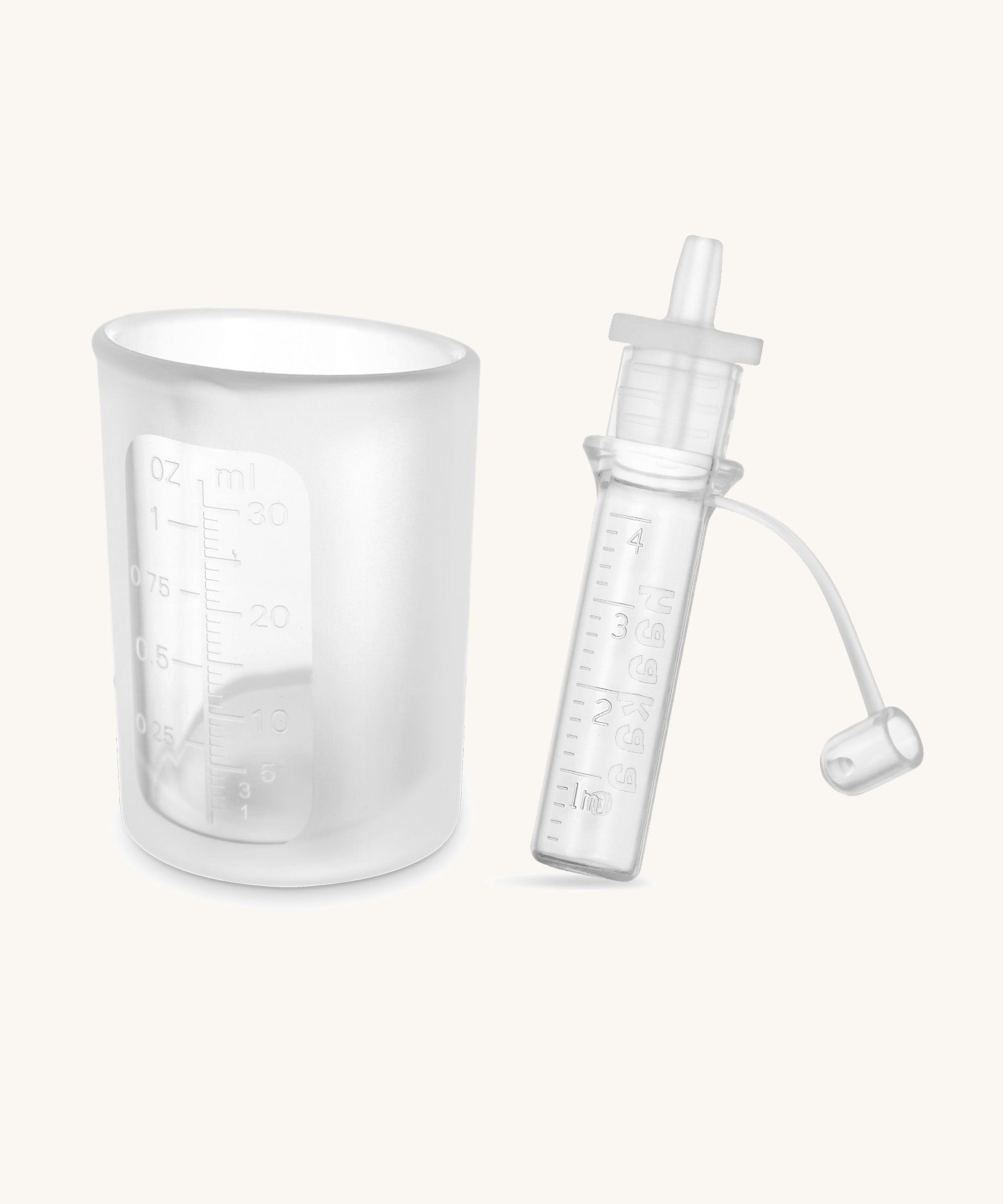 Haakaa colostrum collector and storage tube showing measures on the side.