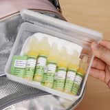 Colostrum storage tubes from the Haakaa colostrum collector feeding pack shown filled and placed in the storage box.