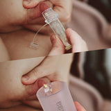 Collostrum storage pots and collecting cup from the Haakaa colostrum collector feeding pack being shown in use.