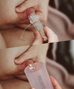 Collostrum storage pots and collecting cup from the Haakaa colostrum collector feeding pack being shown in use.