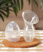 The Generation 1 100ml Silicone Breast Pump, and the Haakaa Silicone Shell Breast Pump and Milk Collector side by side
