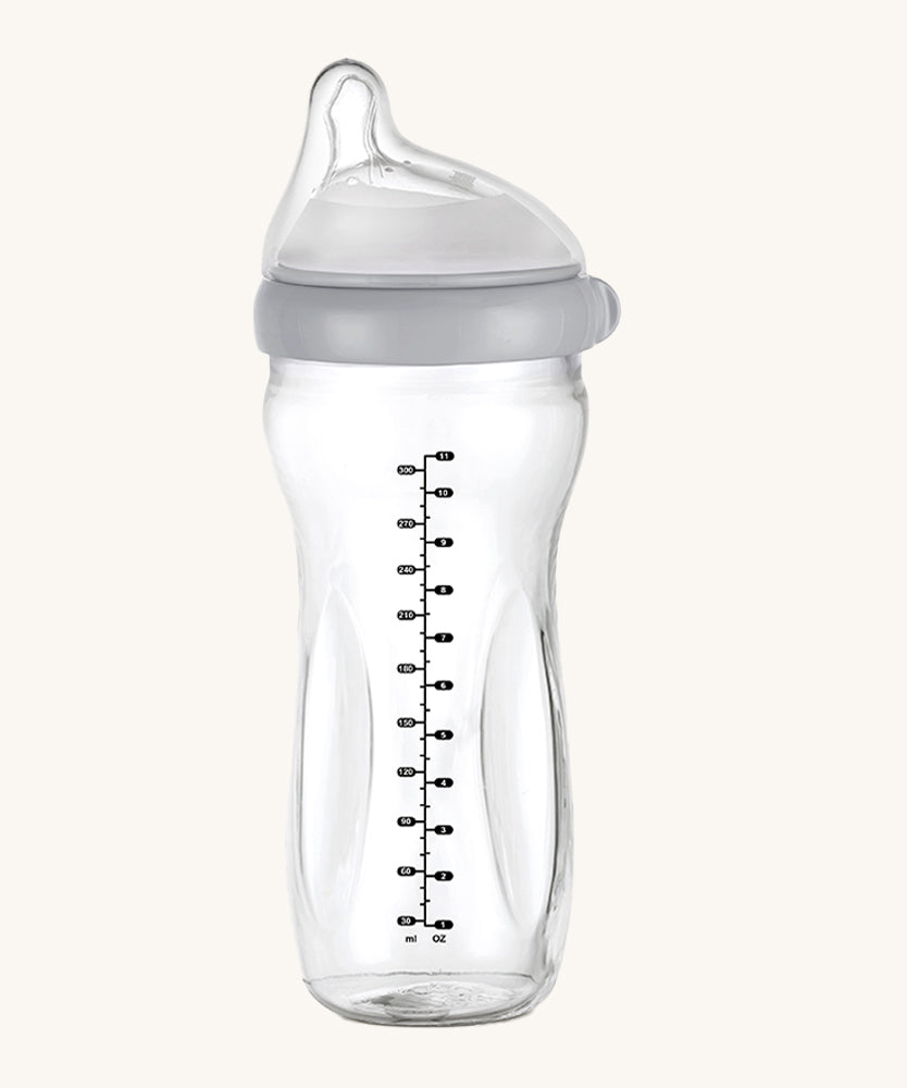 The Haakaa Generation 3 Glass Baby Bottle 300ml in grey, on a cream background