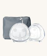 The Haakaa Ladybug Silicone Breast Milk Collector and storage bag in Bluestone, which is a slate grey/blue colour. On a cream background