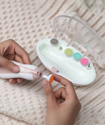 A person attaching a filing pad to the Baby Nail Care Set