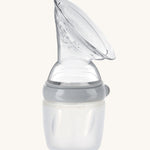 The Haakaa Generation 3 160/250ml Silicone Breast Pump in grey on a cream background