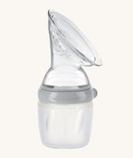 The Haakaa Generation 3 160/250ml Silicone Breast Pump in grey on a cream background
