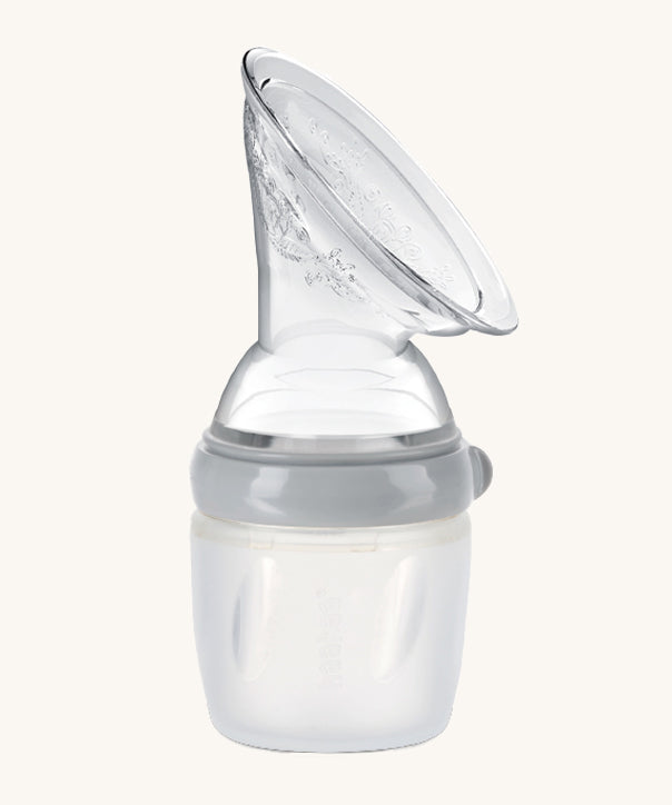 The Haakaa Generation 3 160/250ml Silicone Breast Pump in grey on a cream background