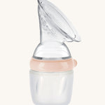 Generation 3 160ml Silicone Breast Pump in peach on a cream background