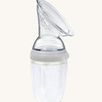 The Generation 3 250ml Silicone Breast Pump in grey on a cream background