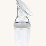 The Generation 3 250ml Silicone Breast Pump in grey on a cream background