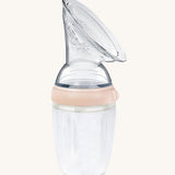 Generation 3 250ml Silicone Breast Pump in peach on a cream background