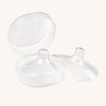 The Haakaa Silicone Nipple Shields, with one shield inside the container box, and one to the right side