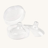 The Haakaa Silicone Nipple Shields, with one shield inside the container box, and one to the right side