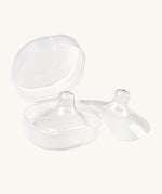The Haakaa Silicone Nipple Shields, with one shield inside the container box, and one to the right side
