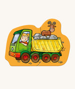 A dumper truck jigsaw piece with from the Haba construction jigsaw set on a cream background.