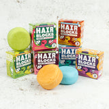 Hair Blocks Solid Shampoo Bars with their cardboard boxes