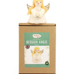 The Makerss - Angel Needle Felt Kit, complete angel sat on top of its cardboard packaging.