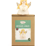 The Makerss - Angel Needle Felt Kit, complete angel sat on top of its cardboard packaging.