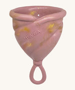 Hevea LOOP Menstrual Cup Size 3 - Golden Rosewood, a pink rubber menstrual cup with gold flecks and a loop stem.