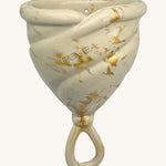 Hevea LOOP Menstrual Cup Size 2 - Golden Sand, a cream natural rubber menstrual cup with gold flecks and a loop stem. 