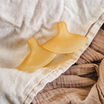 Hevea Natural Rubber Nipple Shields - 2 Pack side view on cotton muslins and sheets. 