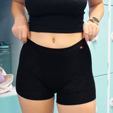  Hey Girls My Period Shorts in Black on a blue background