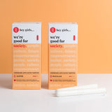 Hey Girls Tampons in Regular and Super Absorbency boxes, with the tampons in front. On an orange and white background