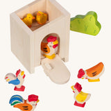 Holztiger small handcrafted wooden stable with the roof off shows a wooden chicken and chick figures inside