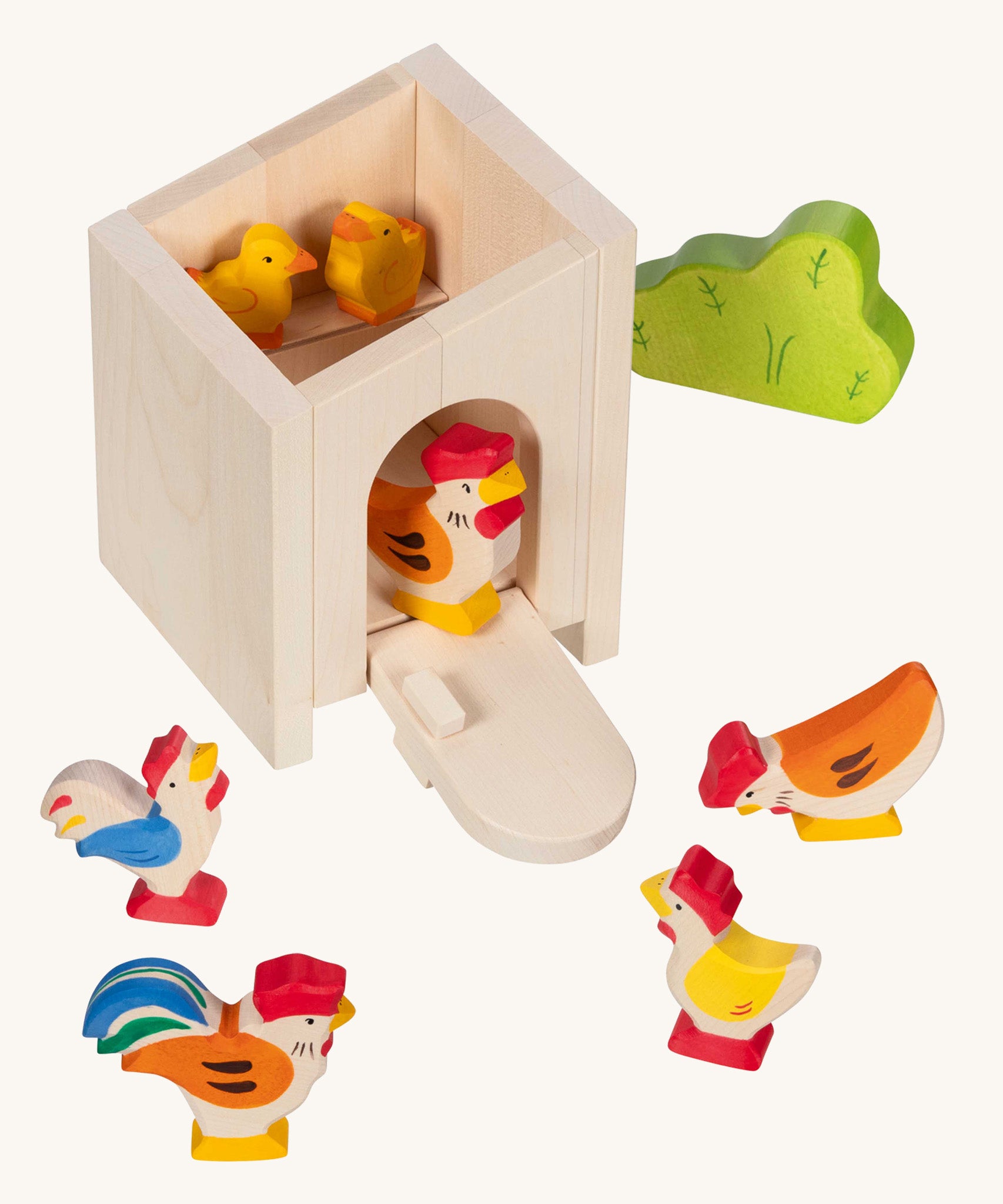 Holztiger small handcrafted wooden stable with the roof off shows a wooden chicken and chick figures inside