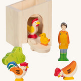 Holztiger small handcrafted wooden stable with the roof off, front door pulled down with wooden farm animal figures infront