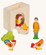 Holztiger small handcrafted wooden stable with the roof off, front door pulled down with wooden farm animal figures infront
