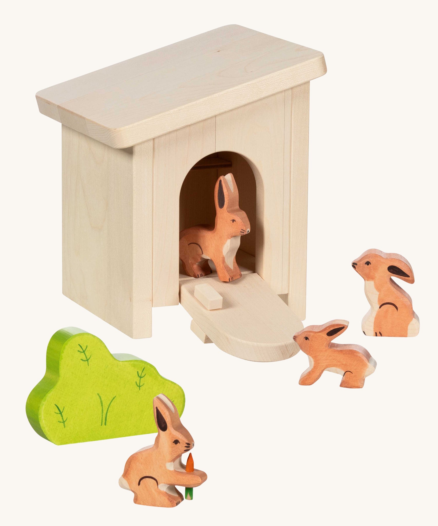 Holztiger small handcrafted wooden stable with the roof on, front door pulled down with wooden rabbit animal figures inside