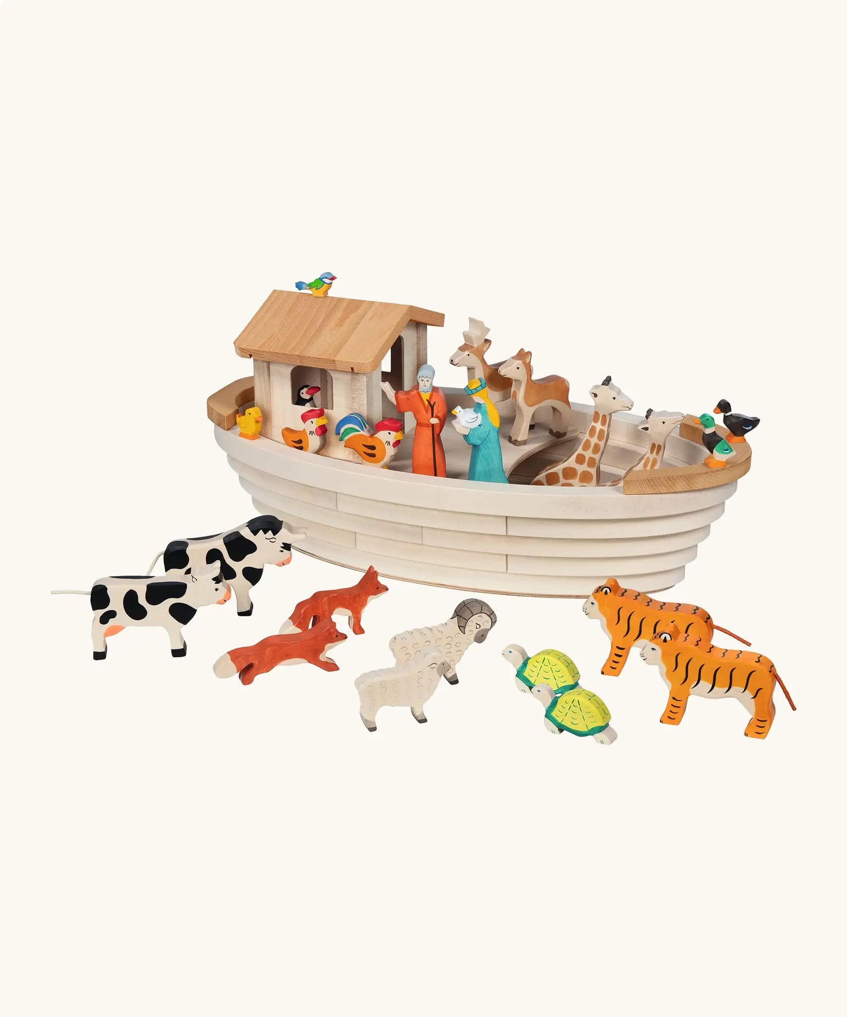 Holztiger handcrafted wooden Noah's ark with different animal figures on top of the deck and around the ark